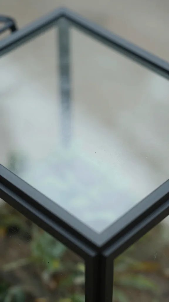 closeup of slightly ajar terrarium lid for venting