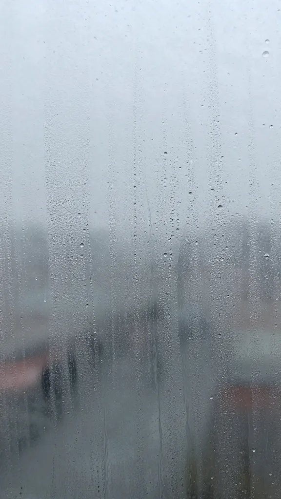 condensation droplets on glass with ventilation gap, closeup