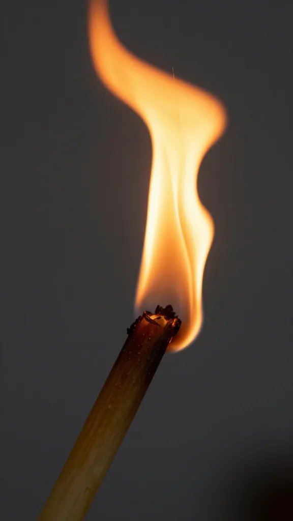Closeup of burnt wick with amber glow