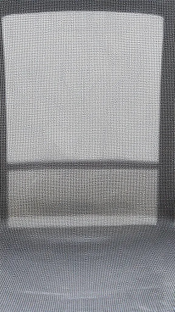 Detailed shot of mosquito netting texture over a chair